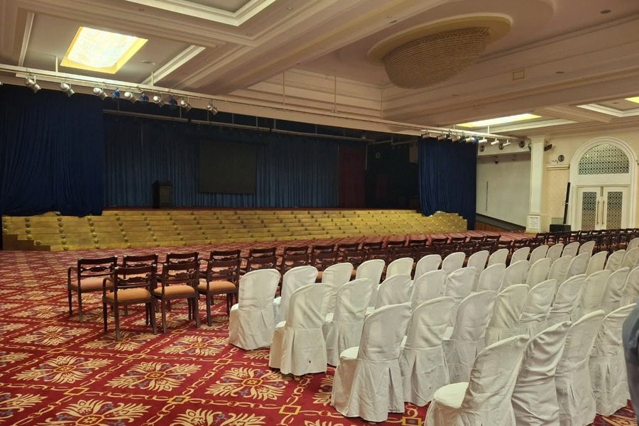 Stage and seating in the Temple Trees hall
